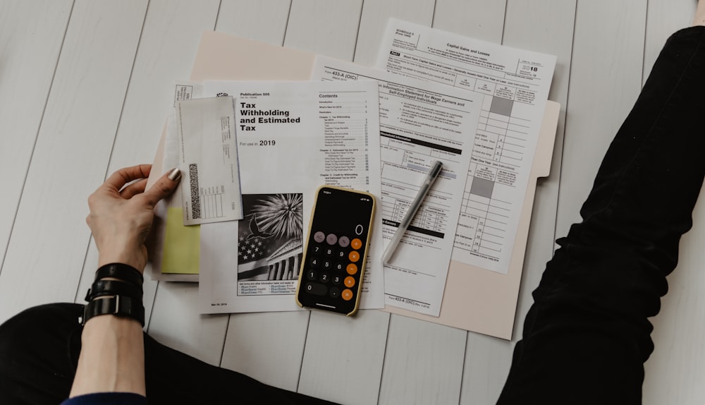 Desk with calculator and financial paperwork