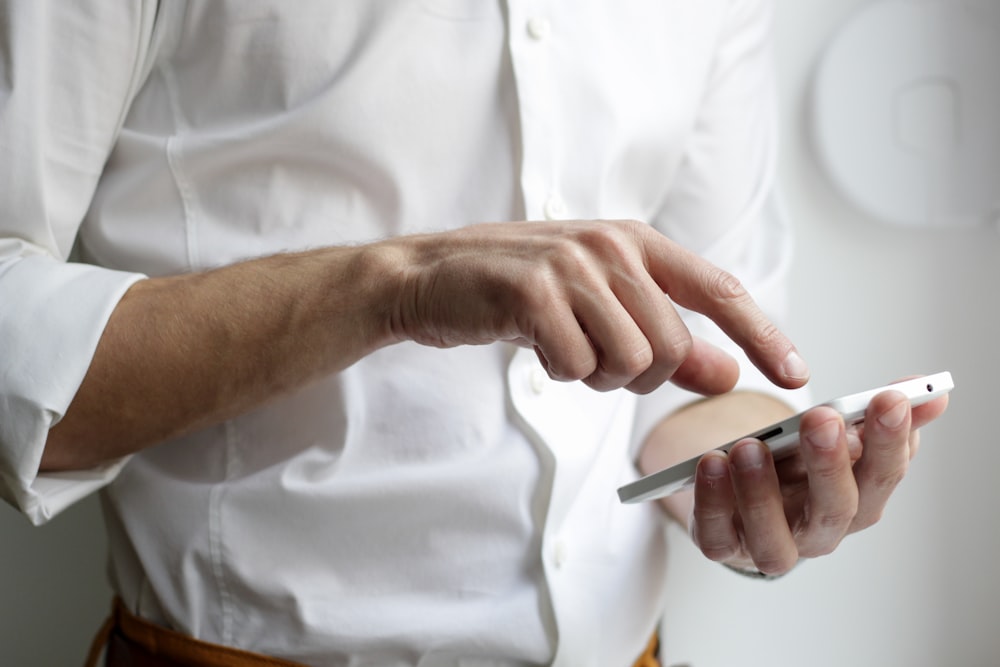 Hands working across tablet and keyboard