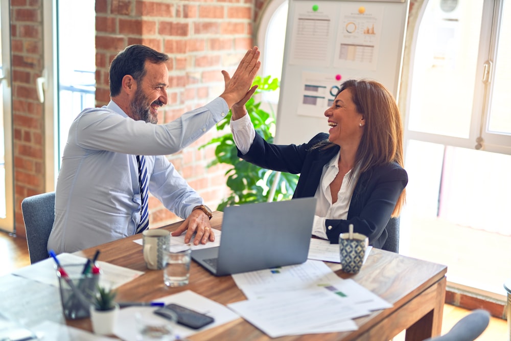 Advisors reviewing documents in a meeting