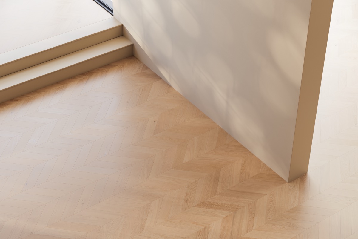 Minimalist interior detail with herringbone wooden floor