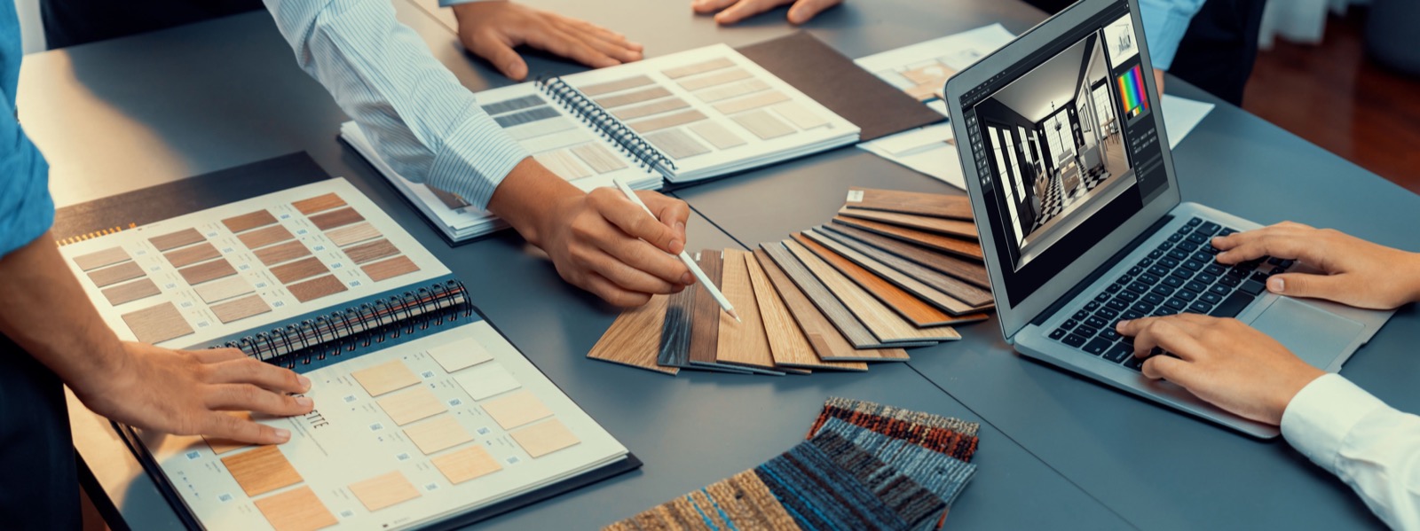 Design team reviewing wood samples in a showroom