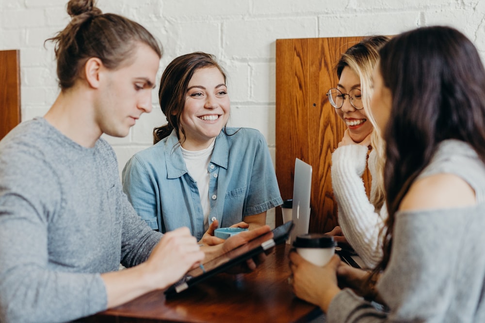 A leadership team laughing around a table