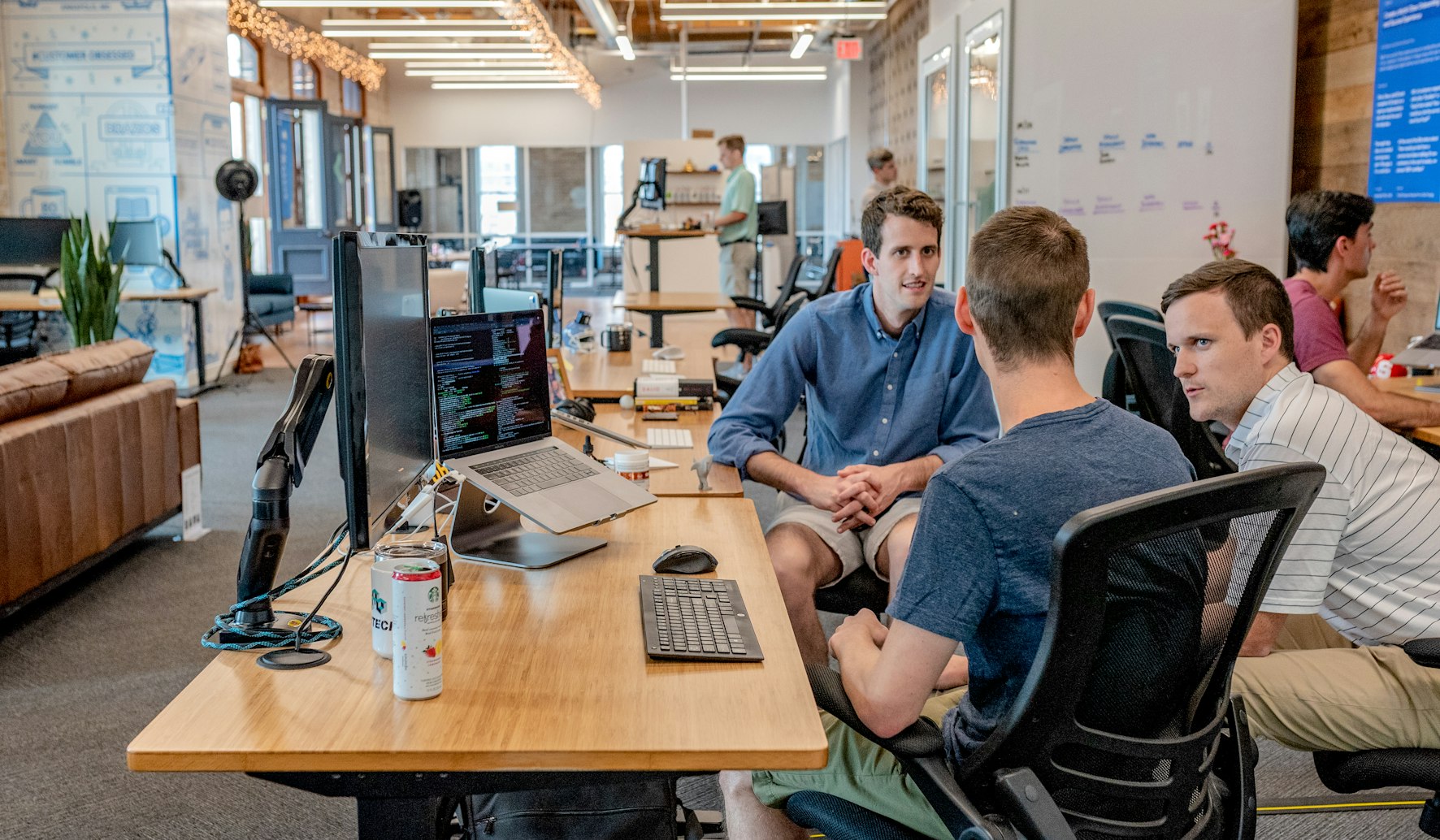 Open office with teams collaborating