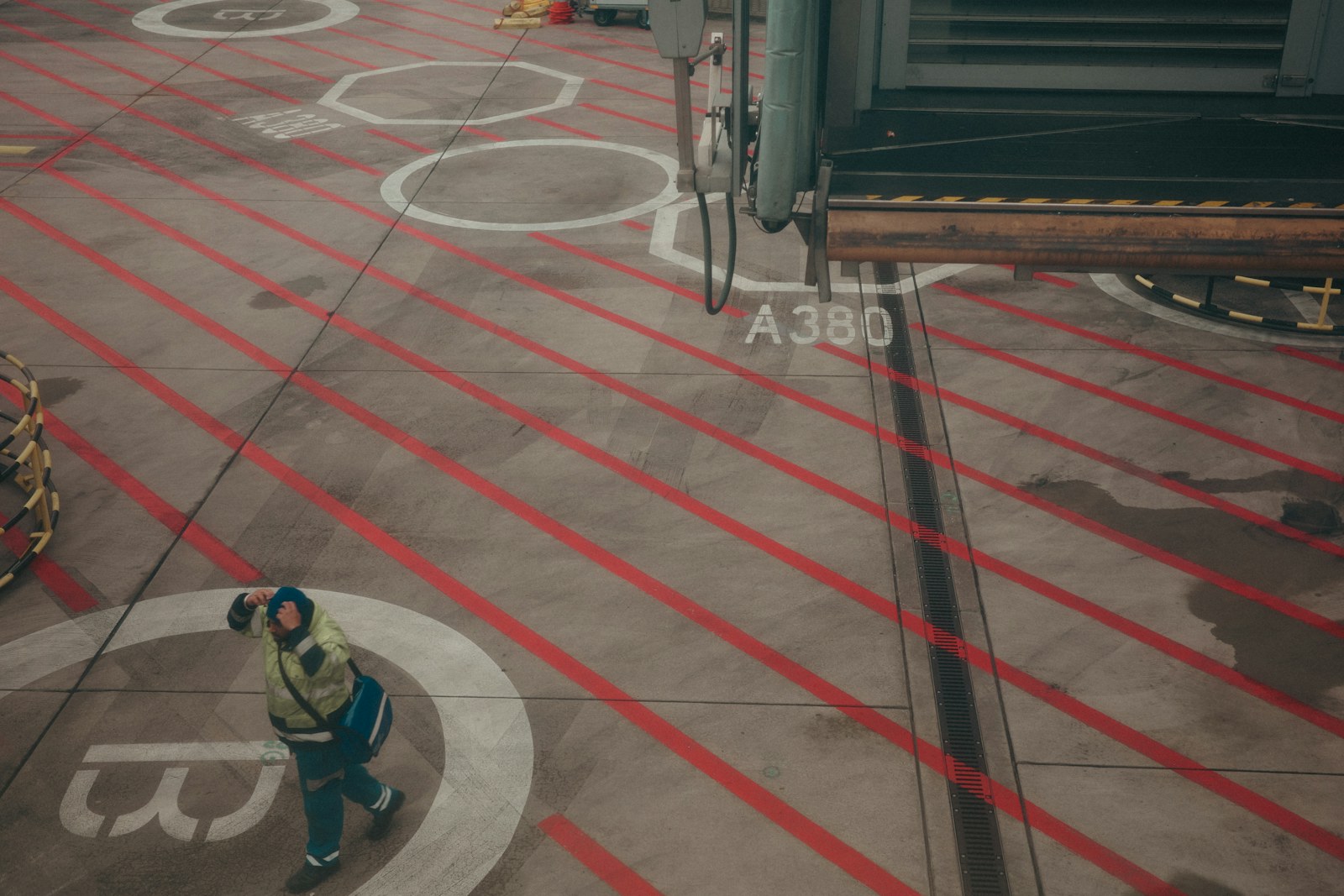 Ground crew guiding an aircraft on the tarmac
