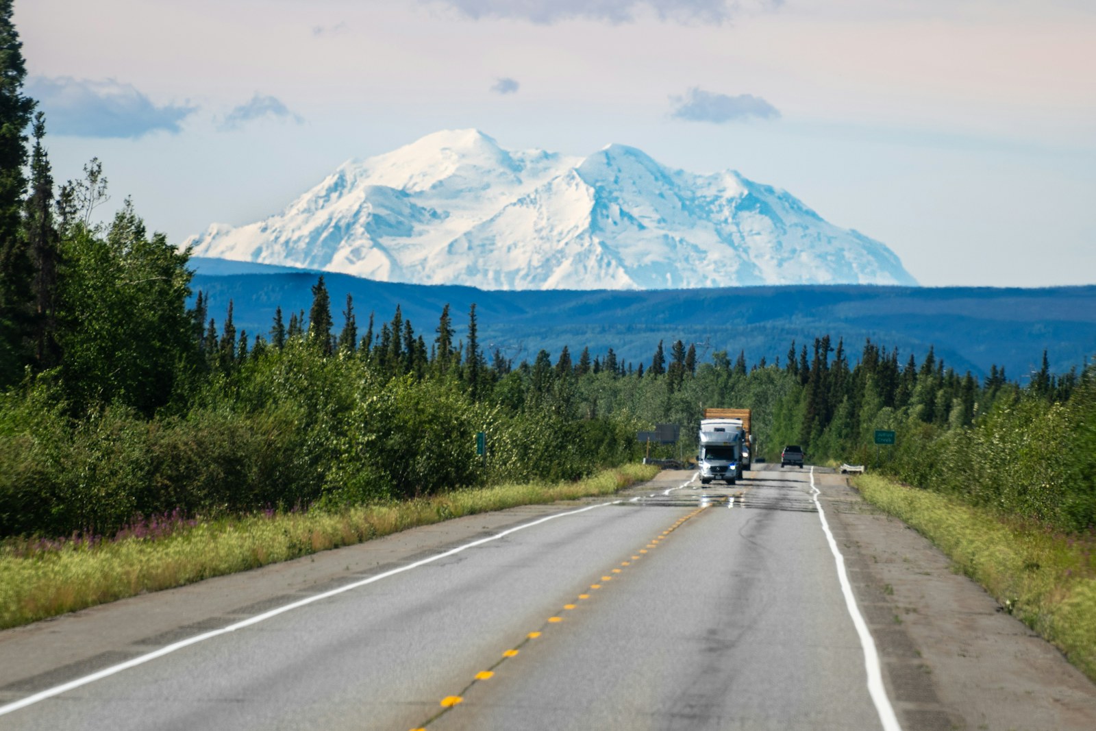 White semi truck under mountain peaks