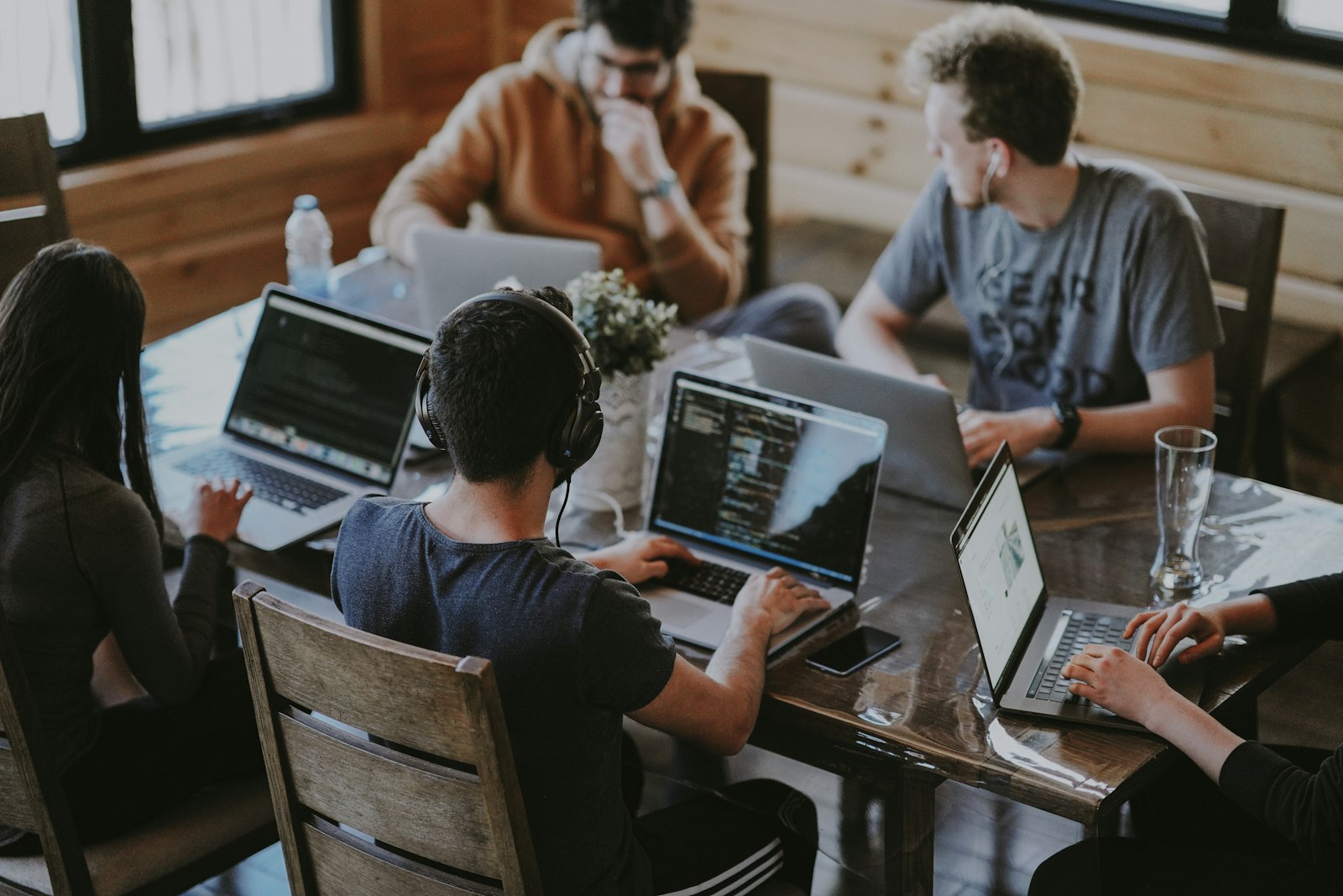 Engineers pair programming on laptops