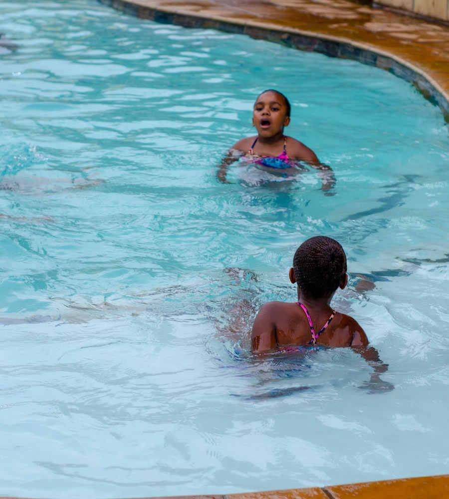 Kids splashing and swimming in an outdoor pool