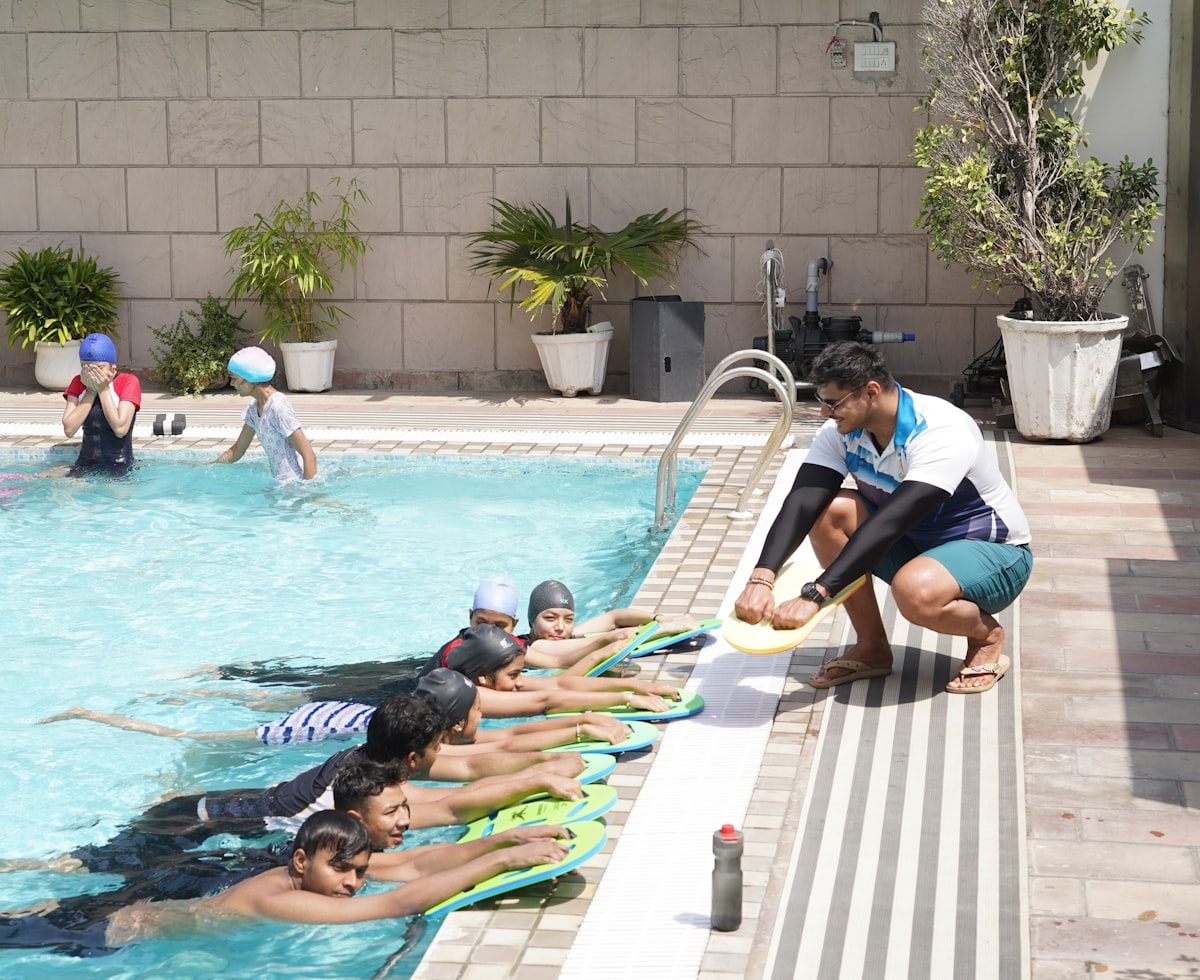 Kids at a swim training session by the pool