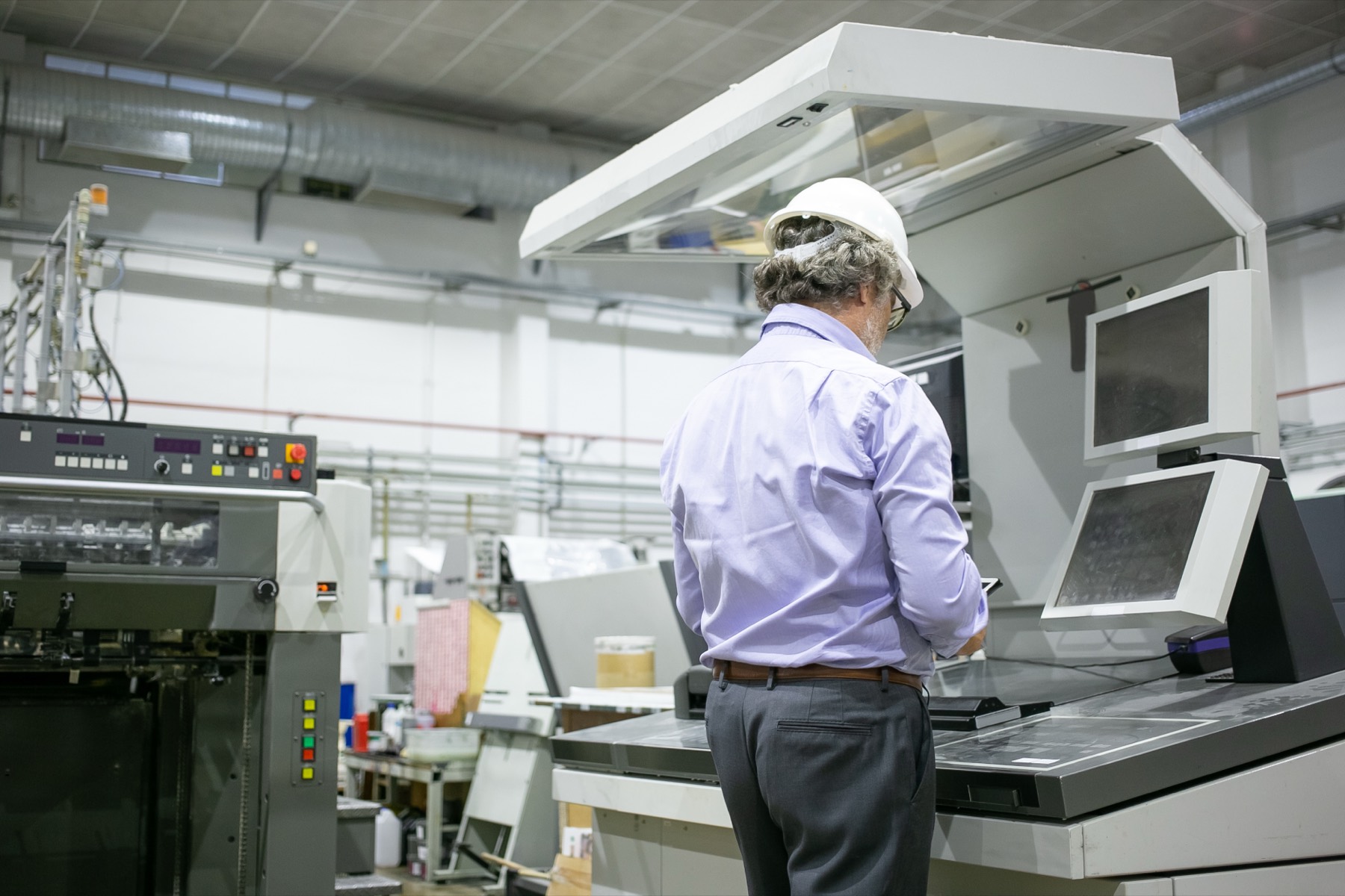 Plant engineer checking a converting line