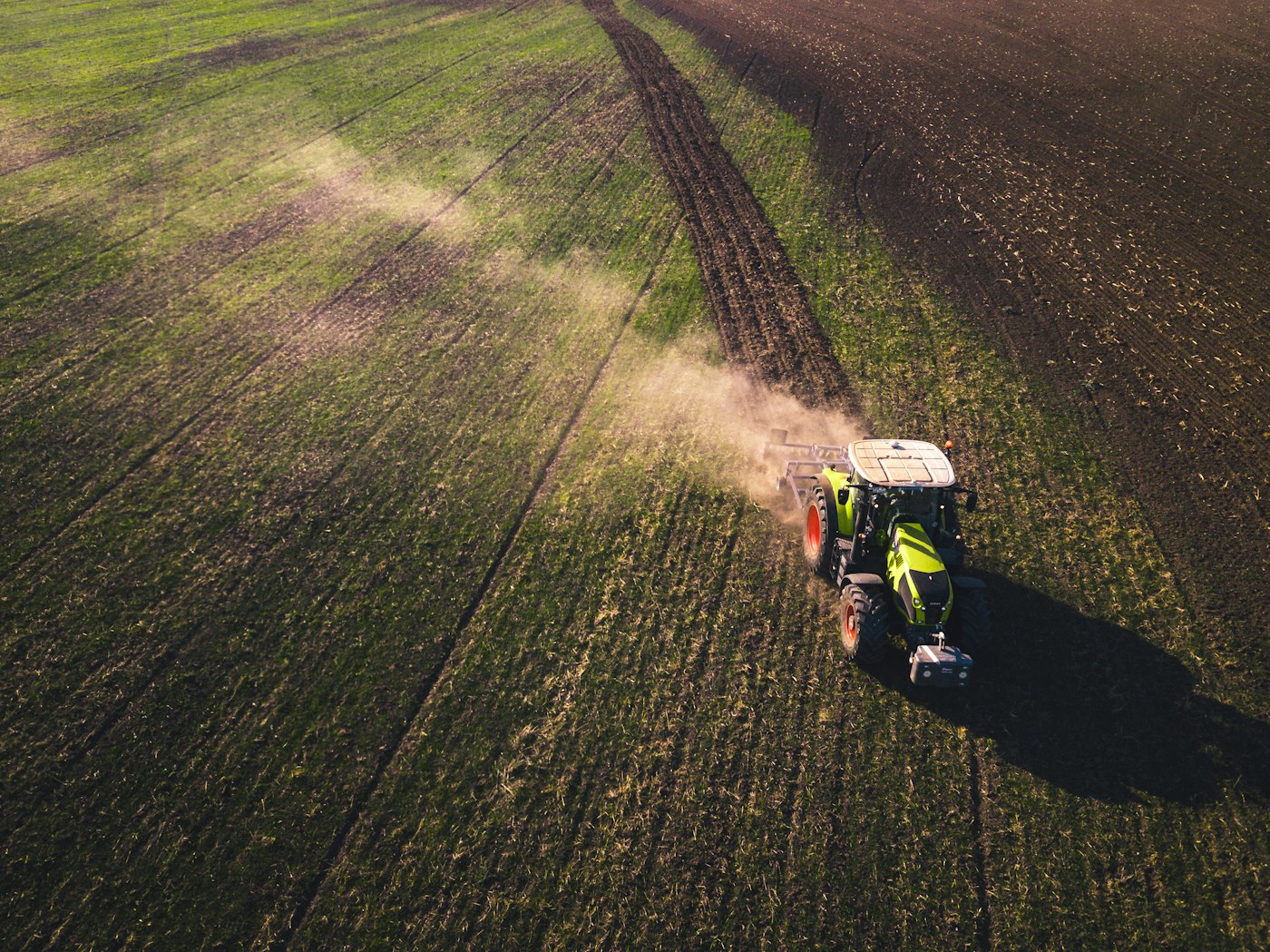 Aerial view of a tractor working a large field